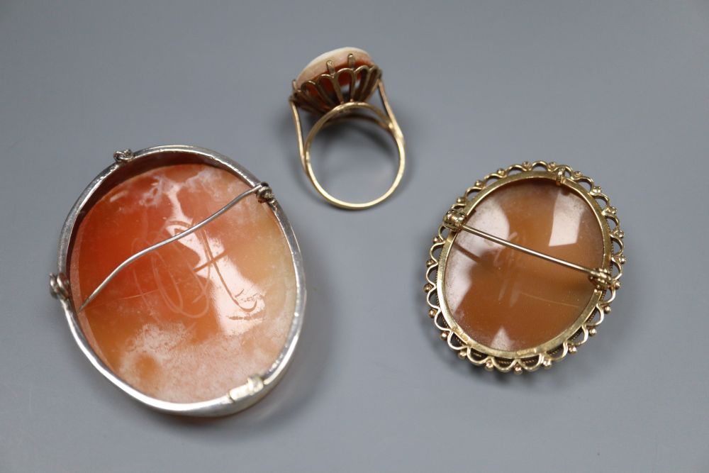 A 9ct gold and oval cameo shell ring, size N, gross 5.8 grams, a 9ct gold mounted cameo brooch and a 925 mounted cameo brooch